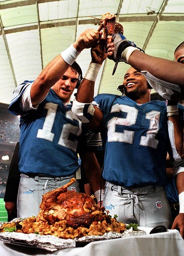 A Detroit Lions fan wears a turkey hat for Thanksgiving during an NFL  football game against the Houston Texans at Ford Field in Detroit,  Thursday, Nov. 22, 2012. (AP Photo/Rick Osentoski Stock