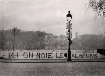 The banner reads (translated): "Here we drown Algerians"