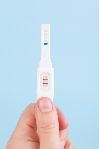 Father-Holding-Pregnancy-Test