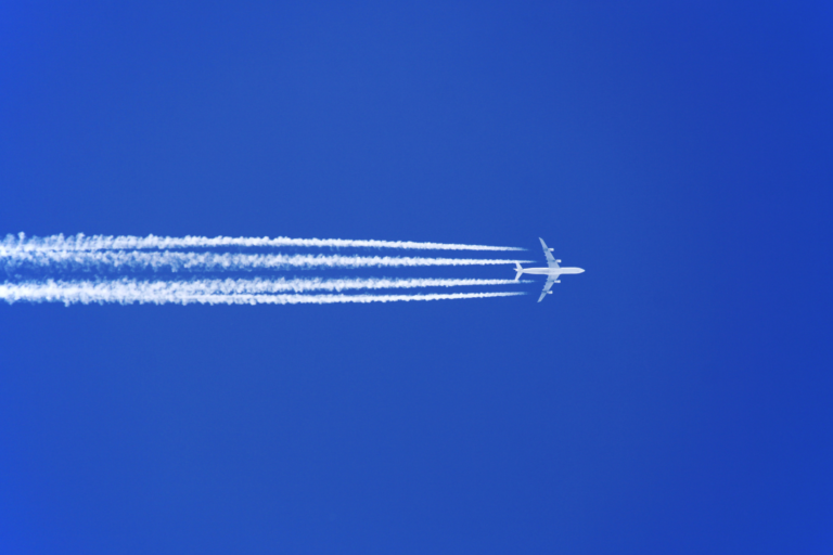 What Causes the Smoke Trails Behind Airline Planes High in the Sky?
