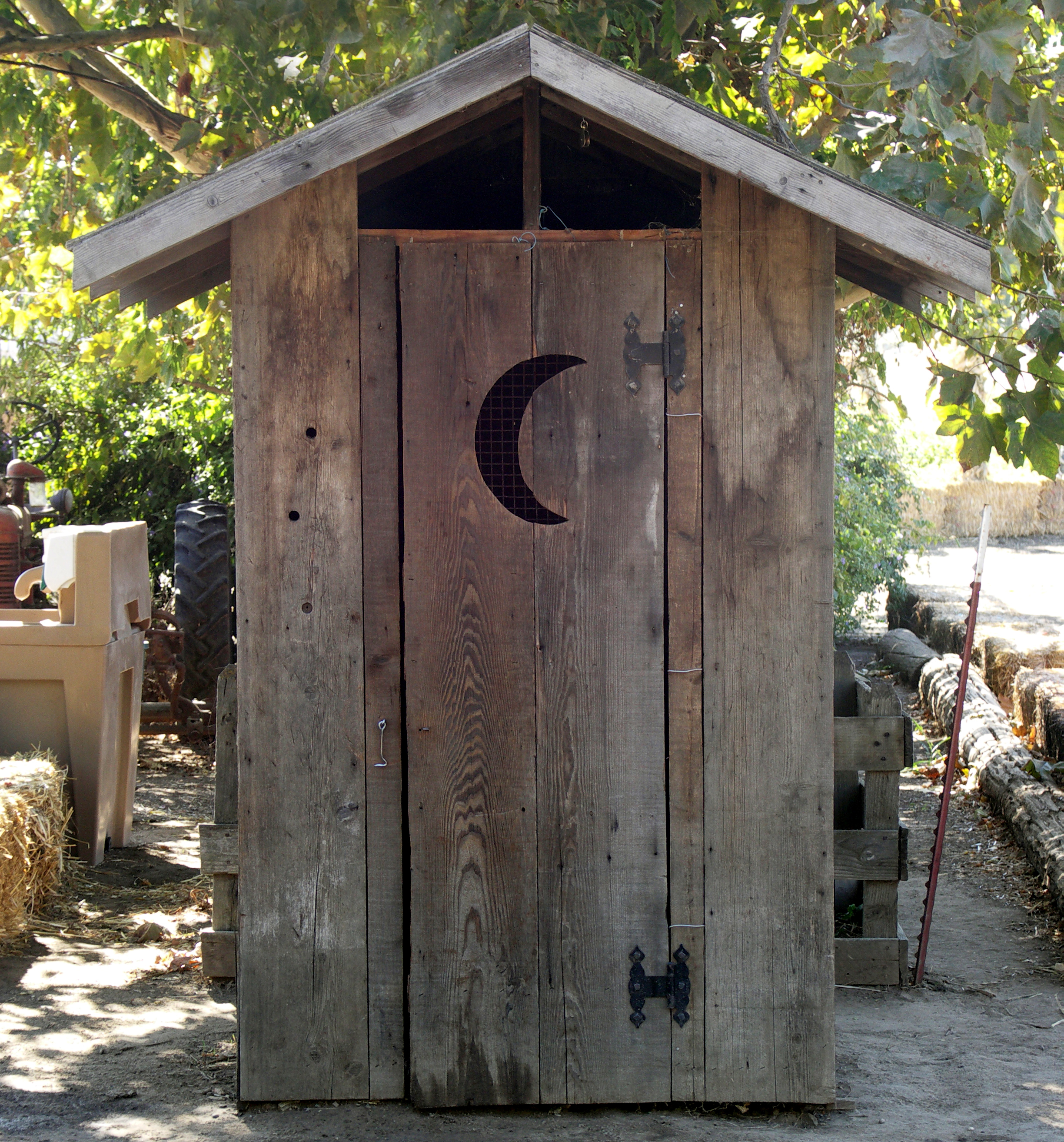 Why Do Outhouses Have a Crescent Moon on the Door?